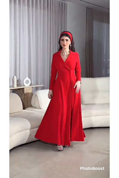 Riva A long, flowing red evening dress. It features an elegant and eye-catchi...