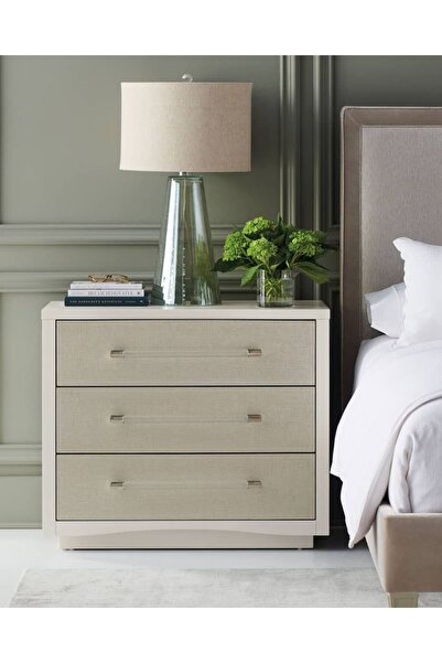 Generic A three-drawer nightstand with an elegant design and luxurious touches