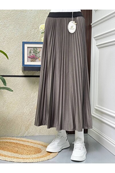 WASL ALKHAIR A luxurious striped crepe skirt with a flowing silhouette and so...