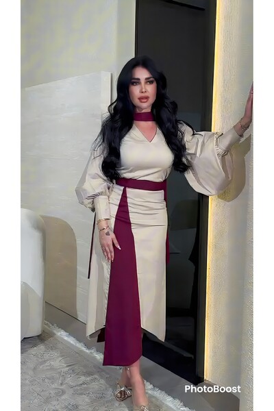 Riva An elegant two-tone Eid dress (beige and burgundy) with a modern and dis...