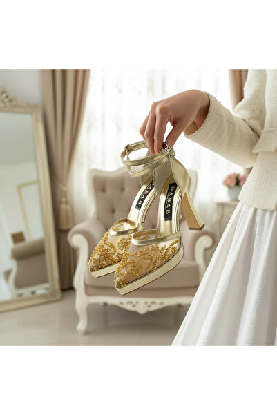 dabab shoes حذاء نسائي ذهبي اللون من PEARLY بكعب عالٍ 11 سم وحزام للكاحل من ا...
