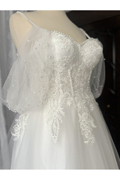 AYŞE KOÇYİĞİT Omuzda İnci serpmeli detaylı Transparan Maxi Helen Gelinlik