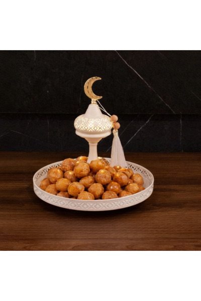 Generic A serving tray with a soft Ramadan design and warm lighting.