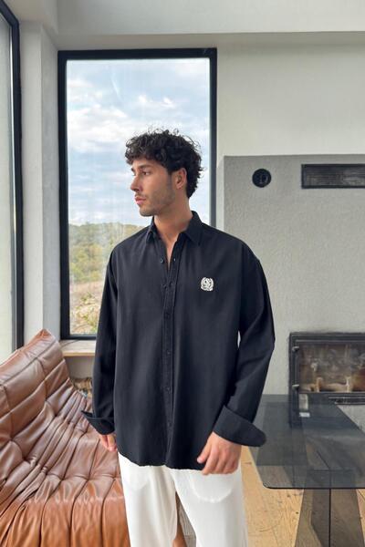 Flaw Wear قميص أكسفورد قصة فضفاضة باللون الأسود