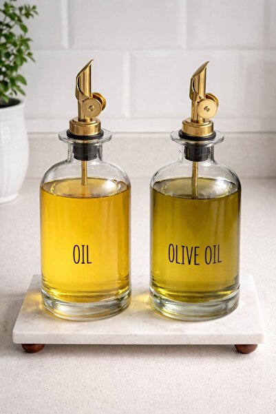 morponi Set of 2 Transparent Glass Oil Bottles with Marble Stand and Gold Hea...