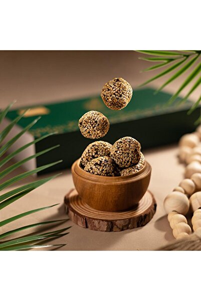 Khisab Alnakhil Dates with tahini, coated with sesame