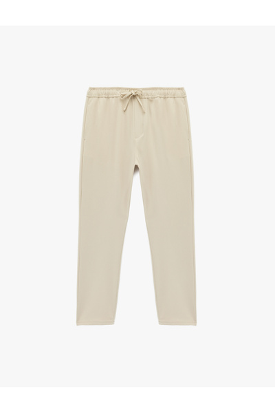 Koton Pantaloni din material textil cu șireturi în talie și buzunare, cu potr...