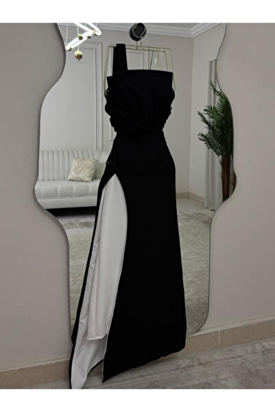 Elora Elora's black one-shoulder dress with an architectural cut