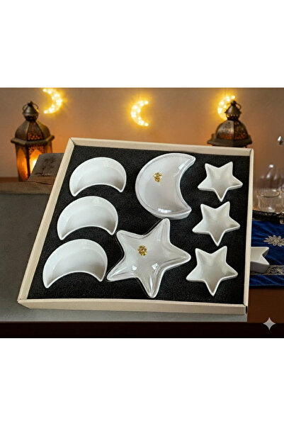 Modern shop A set of crescent and star-shaped porcelain plates for serving an...