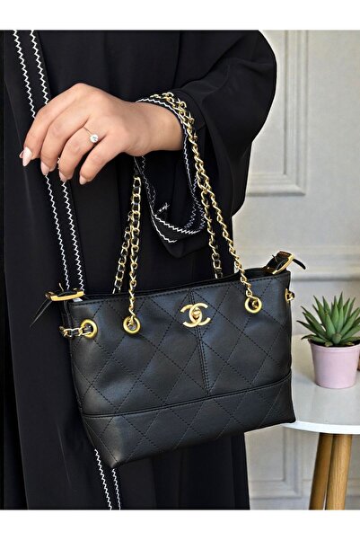 بيت الجملة (translated: House of Wholesale) evening bag