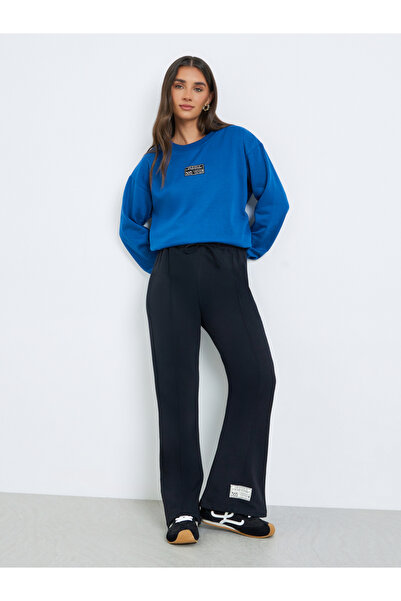 Styli Women Black Black Wide Leg Joggers with Badge Detail