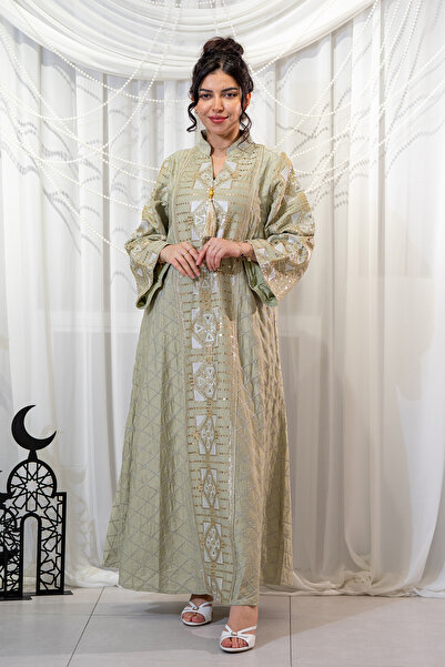 Hasnaa Abaya A Ramadan jalabiya in an apple green color with embroidery and b...