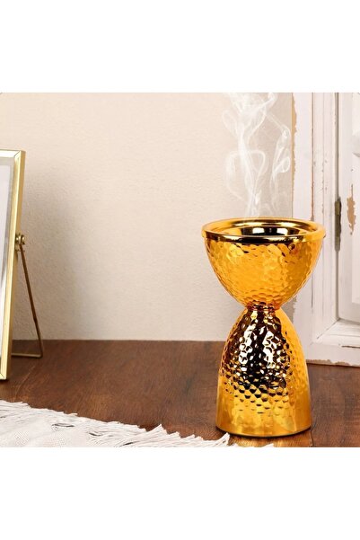 b11 A luxurious, gold-plated incense burner with a modern design and a decora...