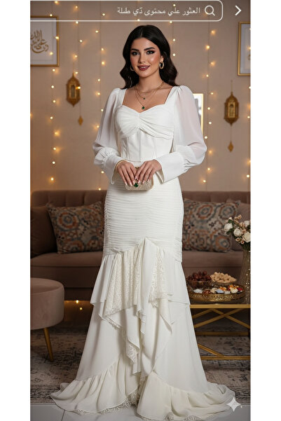 Norlina A soft, pleated lace dress by Nour Lina