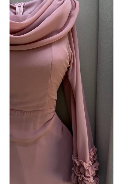 Kayla A flesh-colored chiffon dress with long sleeves and featuring ruffles.