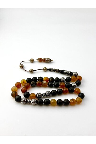 221331 A natural rosary made from the shell of a tortoise, inlaid with silver.