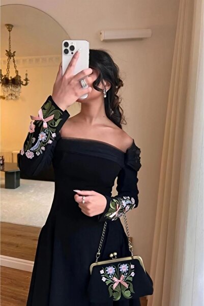 Ta Prince An elegant black dress with a sophisticated design that highlights ...