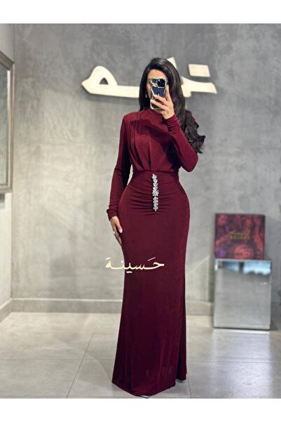 hasinah A burgundy velvet dress with an elegant design
