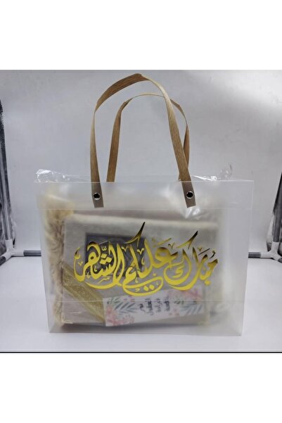 Gerenic Ramadan giveaways: prayer rug with Quran and prayer beads inside a ba...