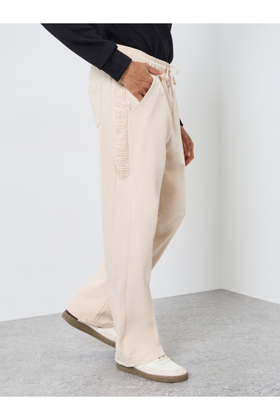 Styli Men Beige Solid Embossed Joggers