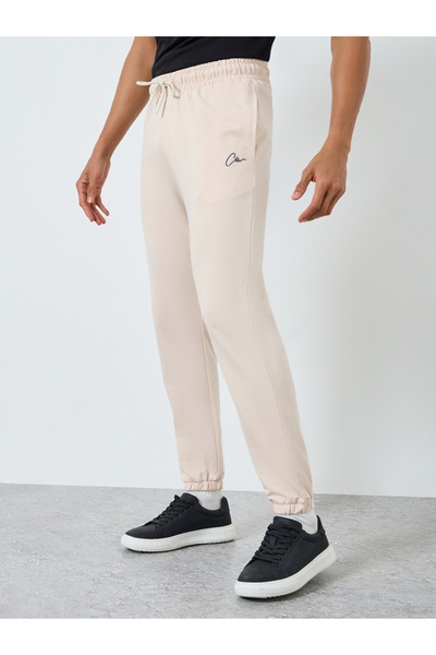 Styli Men Beige Embroidered Slim Fit Joggers