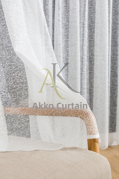 Karesi ستارة من التول ذات ثنيات متفرقة على شكل قرص العسل منسوجة باللون الرملي...