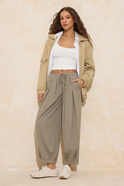 Trendyol Collection Khakifarbene, elastische, gewebte Hose mit Shalwar-Schnit...