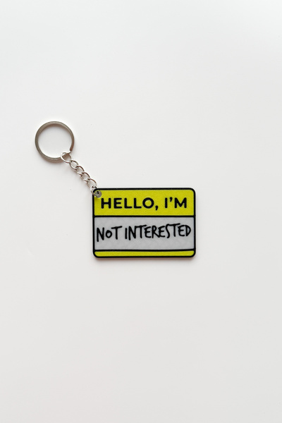 sin istanbul سلسلة مفاتيح فضية بتصميم "لا أهتم"