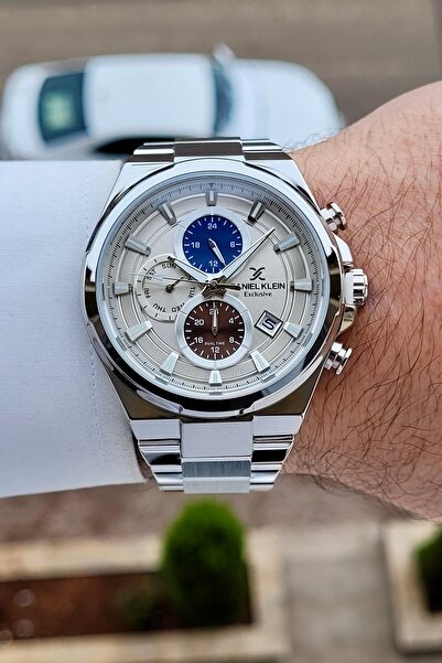 Daniel Klein ساعة يد رجالية ذات لون معدني مع مؤشرات داخلية وضمان لمدة عامين