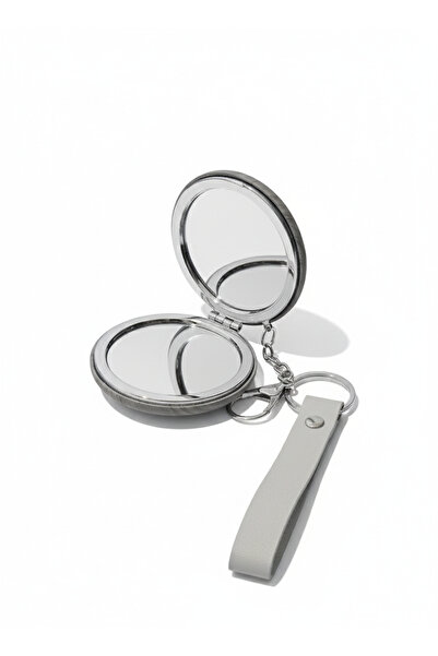 burjalmodah A portable women's hand mirror with a practical and elegant design.