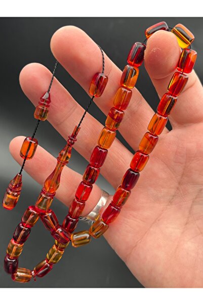 Cemhan Göksal سبحة من حجر العنبر الناري، قطع كبسولي، مقاس 7×10 ملم