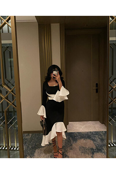 ALGOOD A trendy midi dress in black and white with a color block design.