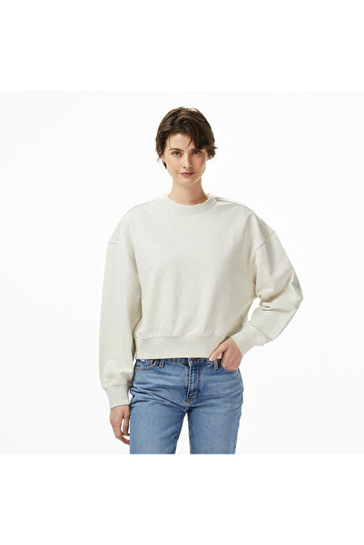 Calvin Klein سويت شيرت نسائي من القطن برقبة دائرية وأكمام طويلة باللون الرماد...