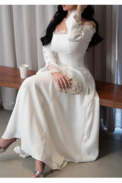 Shad فستان نسائي أنيق باللون الأبيض، يتميز بتصميم راقٍ يجمع بين البساطة والفخ...