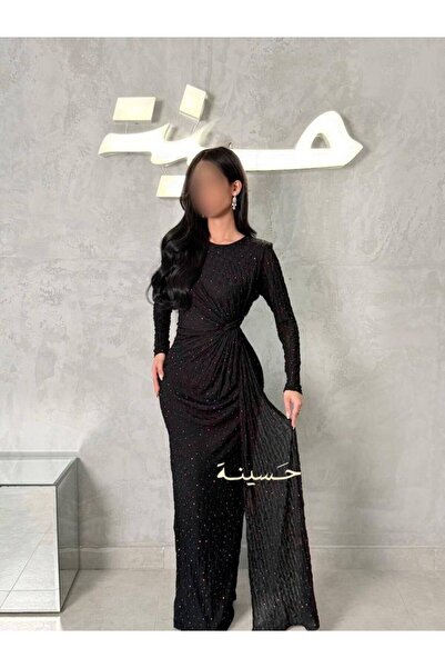 hasinah A luxurious black evening dress with a draped design and a soft sheen.