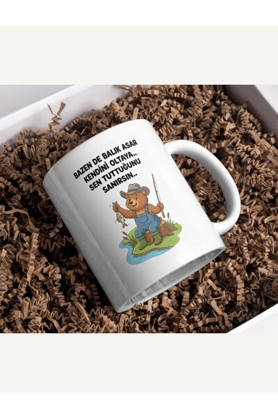 Fikart Humorous Bear Mug with the Saying "Sometimes the Fish Swallows the Fis...