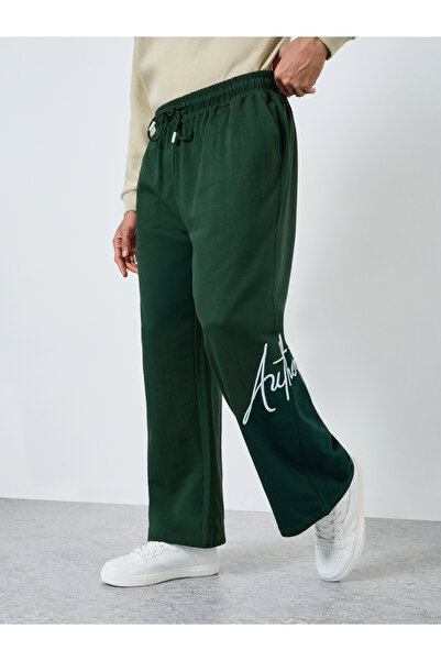 Styli Men Green Embroidered Joggers