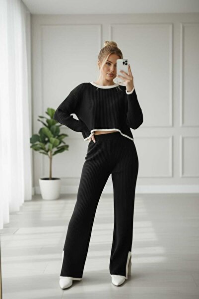 NEWCO طقم سترة وبنطلون نسائي أسود مفصل التفاصيل من قماش مجدّل تريكو ألت أب تو...