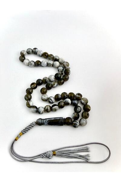 221331 An elegant rosary made of bakelite, with a handmade tassel.