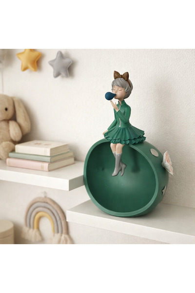 Vi Markets Charming decorative figurine featuring a young girl sitting on a r...