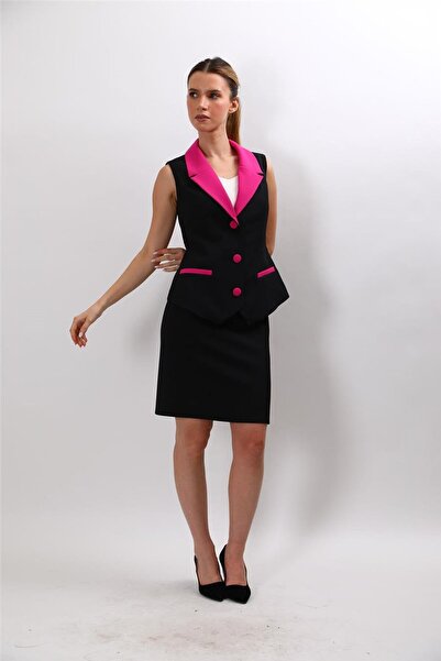 ÖNDER ÖZSOY بقطع قماش مخيطة معاً سترة كلاسيكية بياقة واسعة وتنورة قصيرة ضيقة ...