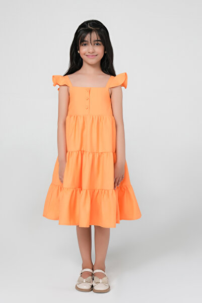 Obaha A dress with gathered layers and a prominent rose