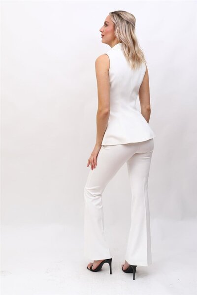 ÖNDER ÖZSOY طقم نسائي مكون من سترة عصرية وبنطلون مطاطي واسع الأرجل مع ياقة شا...