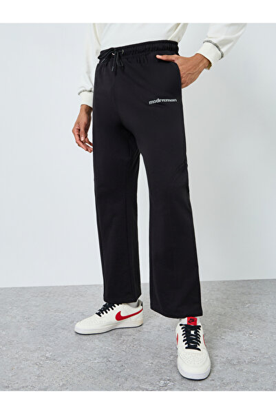 Styli Men Black Slogan Oversized Joggers