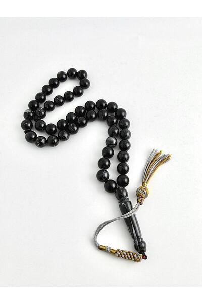 221331 An elegant rosary made of bakelite, with a handmade tassel.
