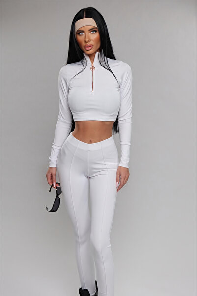 Pretty women's sports suit consisting of tights and a blouse