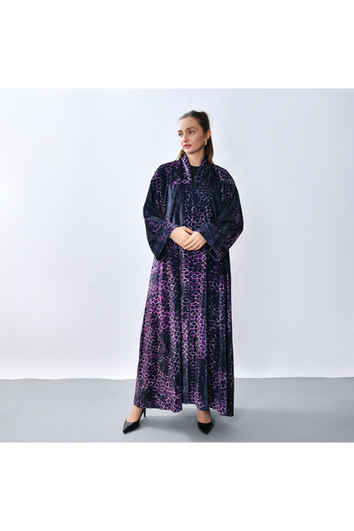 HAWRAA ABAYA An abaya designed with velvet fabric, featuring a modern artisti...