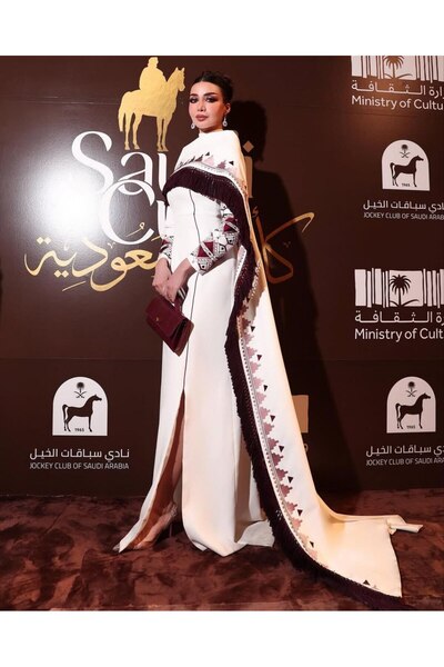 TARFA This dress boasts a charming, regal design that combines the purity of ...