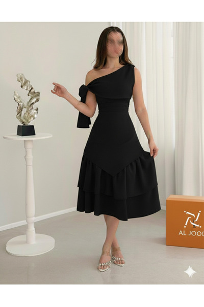ALGOOD A soft, royal black dress with smooth layers in Barbie fabric.