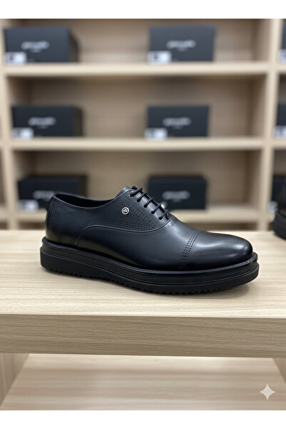 Pierre Cardin The groom's black patent leather shoes offer both style and com...